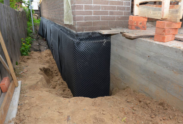 Happy homeowners after waterproofing job in Oconomowoc